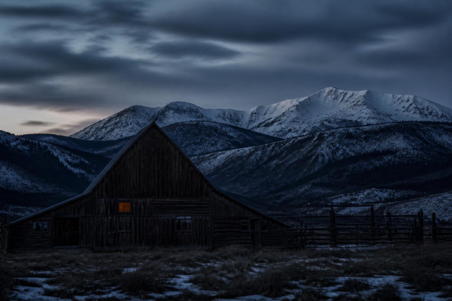 Painted illustration of Grand and Routt County, Colorado, with a weathered wooden barn alone on a snowy hillside and ski tracks curving past it.