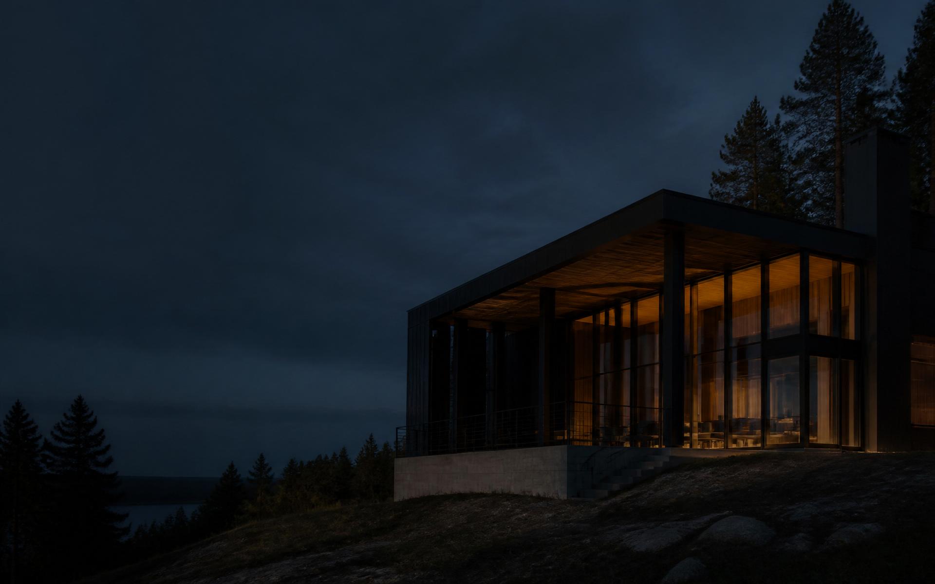 Modern home with warm interior light photographed in the evening
